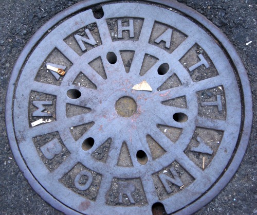 Wayfinding and Typographic Signs - manhattan-born-manhole-cover