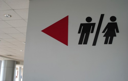 Wayfinding and Typographic Signs - male-female-this-way-please
