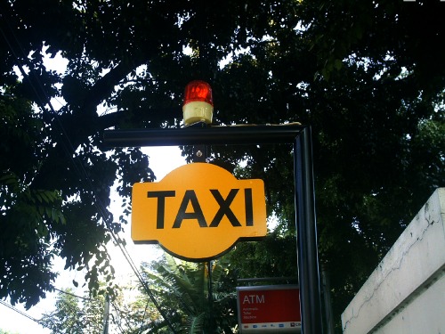 Wayfinding and Typographic Signs - taxi-queue-place
