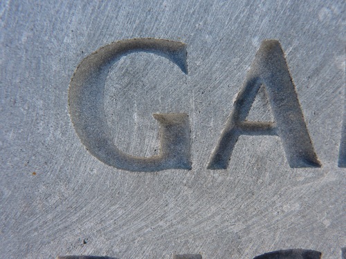 “G” and “A” Carved In Limestone Without Infill Color