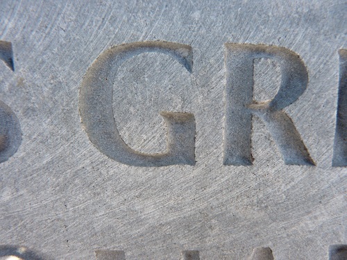 Uppercase “G” and “R” Carved In Limestone