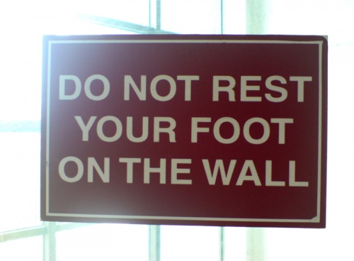 Wayfinding and Typographic Signs - do-not-rest-your-foot-on-the-wall