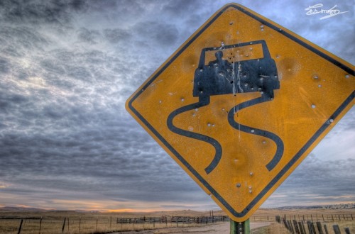 Road sign showing hazardous conditions