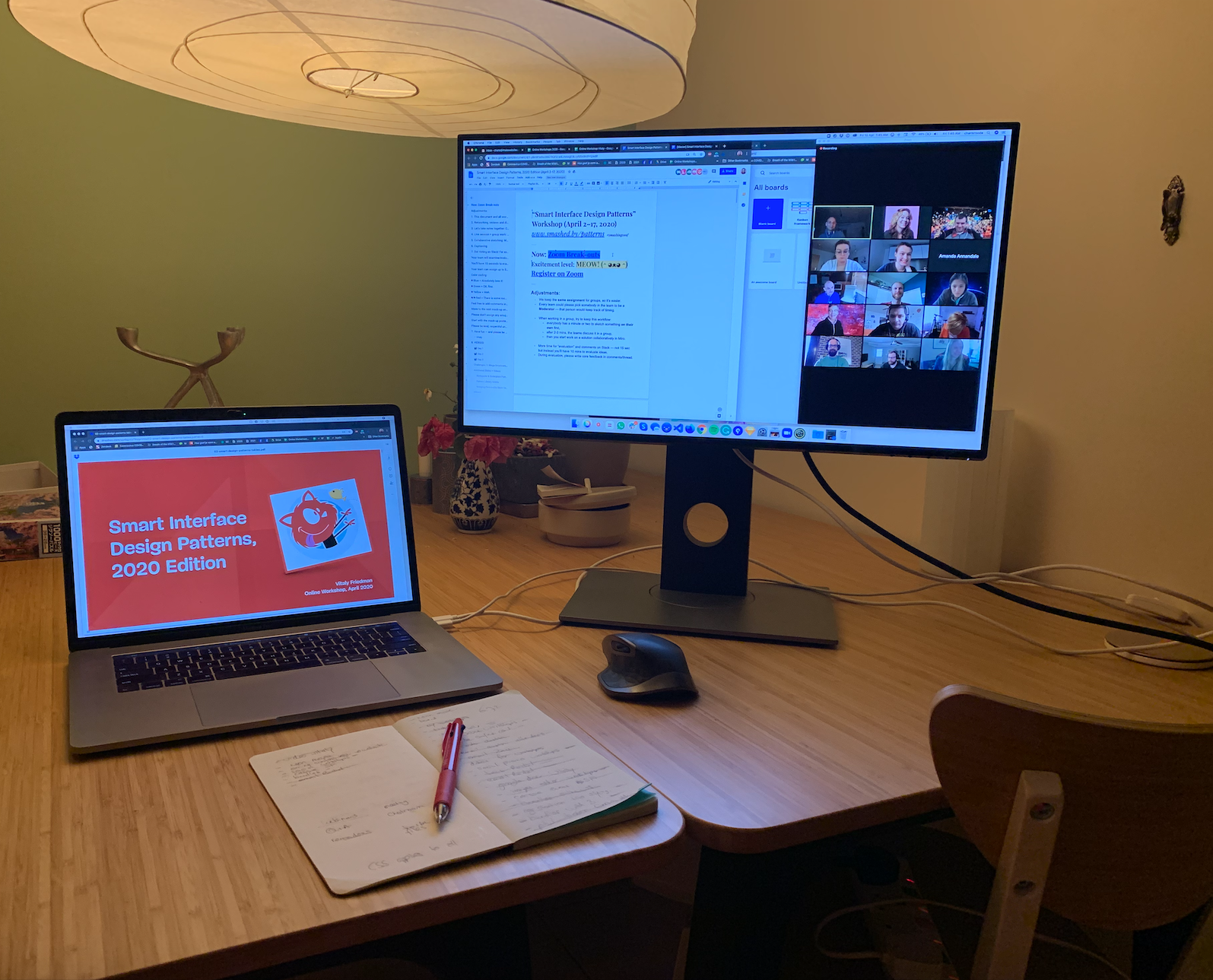 A laptop and screen on a desk