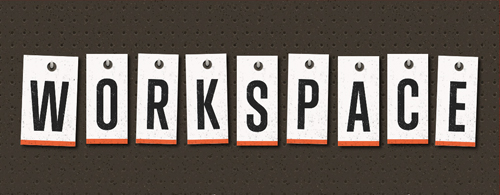 Typographic treatment of the word "workspace" with each letter hanging from a nail