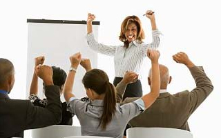 A group of office workers cheering