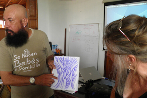 Artist and Design by Nature student Robert Barberena, with one of his pattern sketches at Casa de los Tres Mundos, Granada, Nicaragua, 2013.